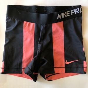 Black and coral Nike Pro shorts